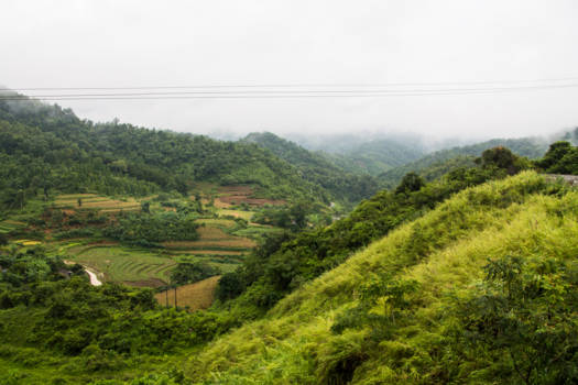Vietnam - Wolken, zon, dal en op de top van de berg
