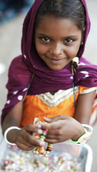 Delhi - Indian girl selling bracelets