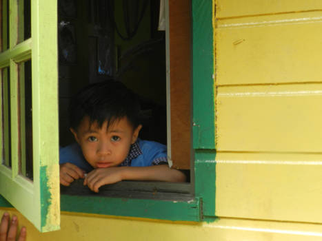Maleisië - Schooljongen in een vissersdorp