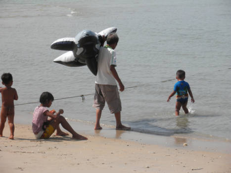 Thailand - Thai family playing in sea