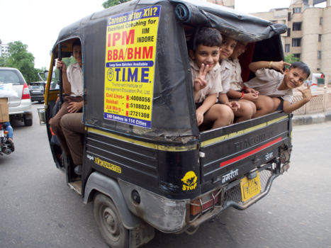 India - Indian schoolchildren are having fun in a tuktuk