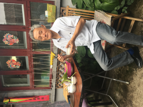 Beijing - Gegeten in de Hutong bij deze man!