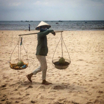 Vietnam - For some a day at tge beach and for others a work day