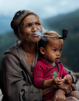 Myanmar - Tattooed woman with child