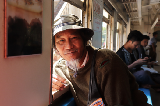 Yangon - Birmese man on circle train