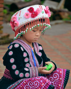 Wat Phrathat Doi Suthep - Hill tribe child in traditional clothing