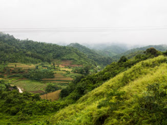 Vietnam - Wolken, zon, dal en op de top van de berg